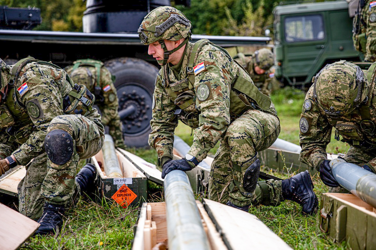 croatia-land-forces-soldiers-from-storm-battery-prepare-some-122mm-rockets-for-loading-into-a-m-92-vulkan__altered-yi0tn2